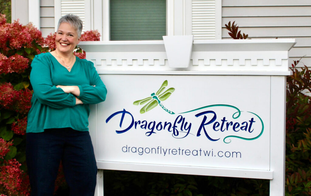 Gerlyn with Dragonfly Retreat Sign